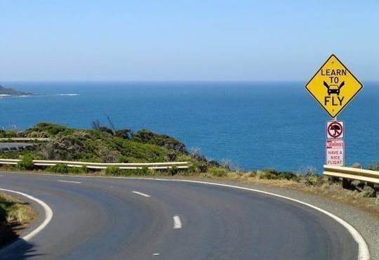 funny-road-sign-cliff