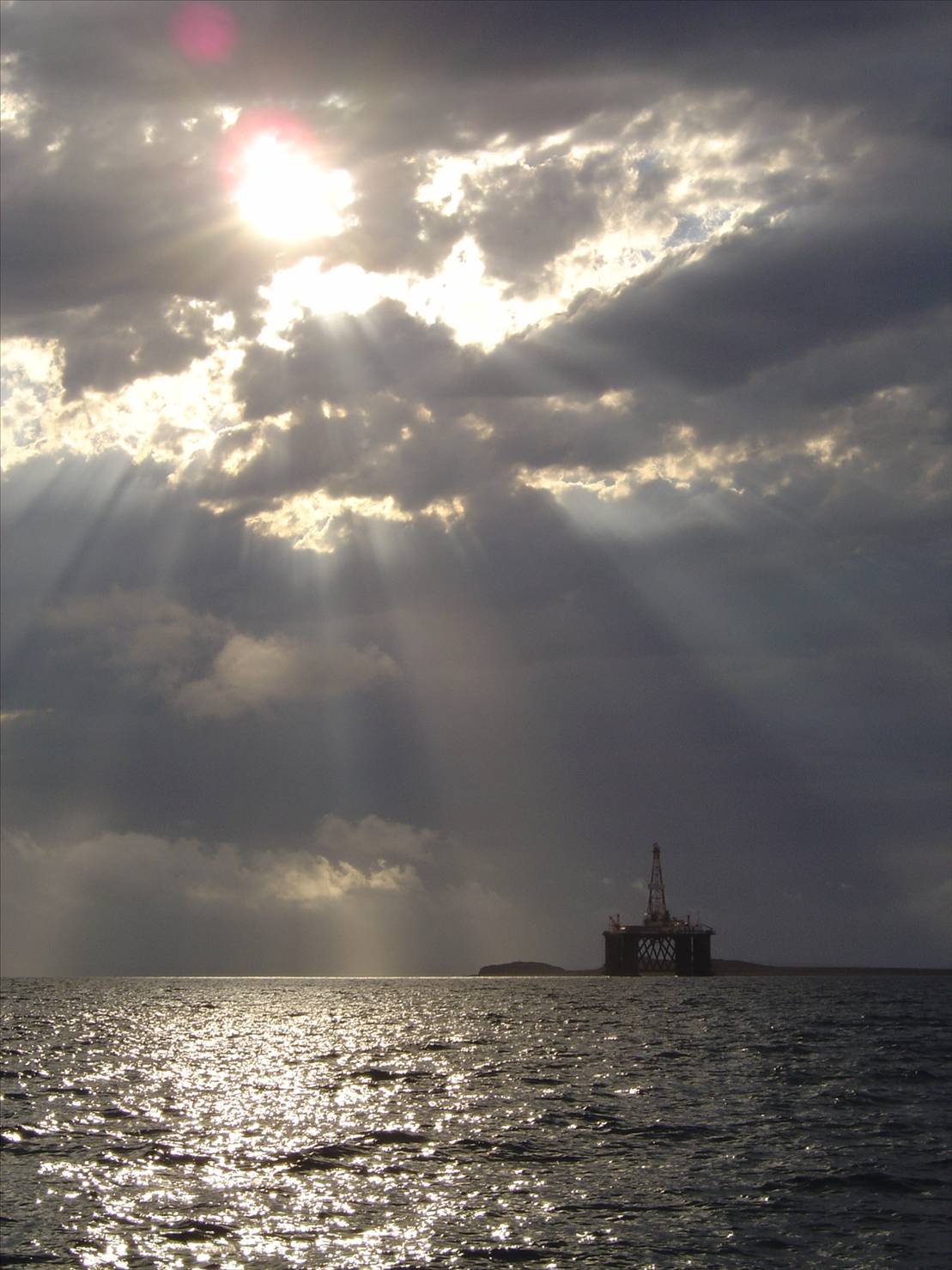 Silvery clouds over the rig