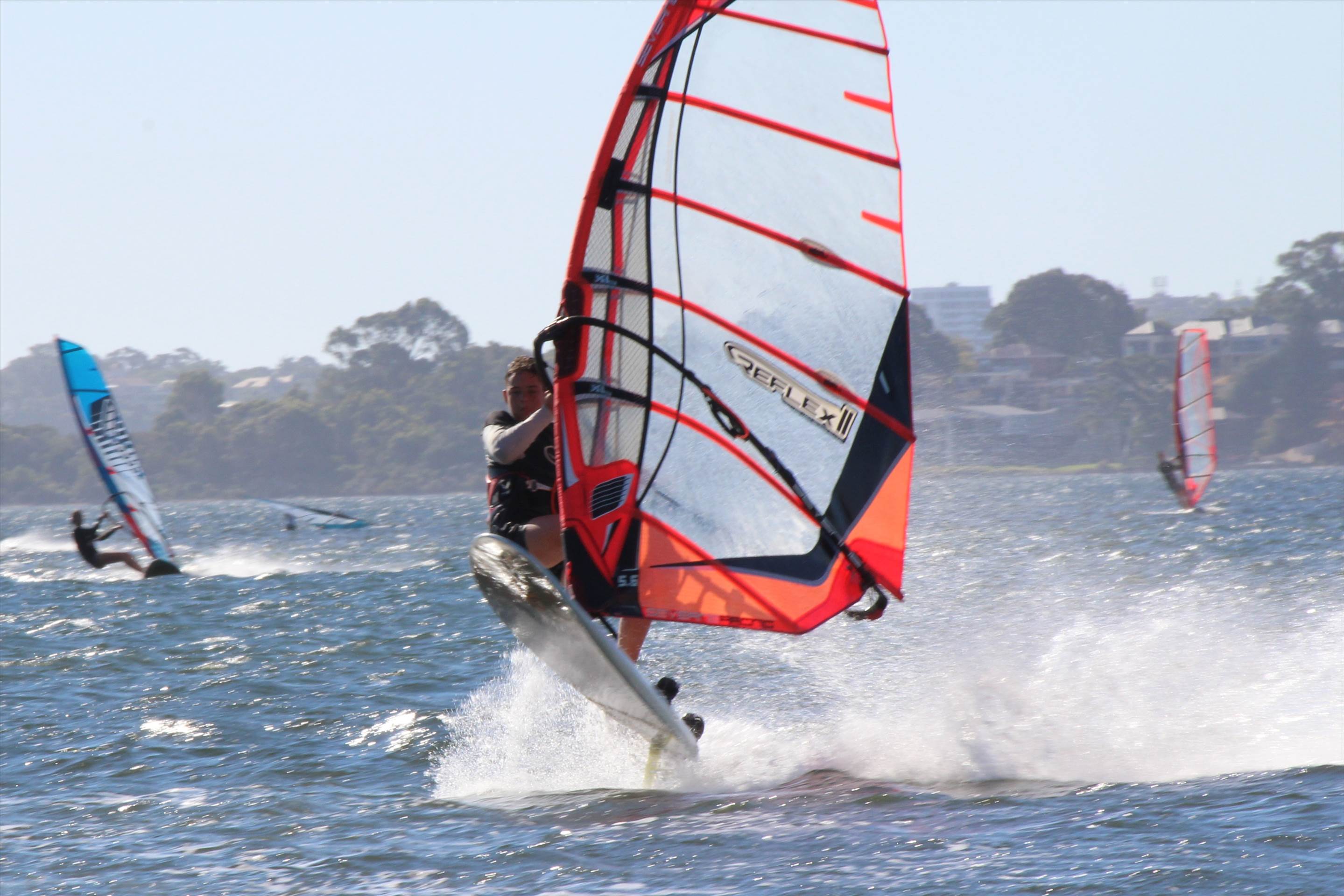 kid windsurfing